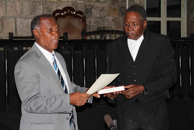 New Premier of Nevis Hon. Vance Winkworth Amory takes Oath of Allegiance administered by Resident Judge at the High Court in Charlestown late Wednesday January 23, 2013