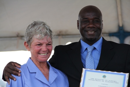 Minister of Agriculture on Nevis Hon. Alexis Jeffers presents an appreciation plaque on behalf of the Ministry and Department of Agriculture, to Patron of the 2013 Agriculture Open Day Mrs. Sandra David