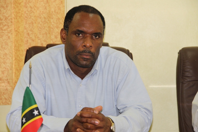 Permanent Secretary in the Ministry of Finance on Nevis Colin Dore at a handing over ceremony at the Ministry of Finance conference room on Nevis on June 24, 2014