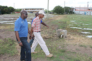 Regional Security Project Manager of Crime Stoppers St. Kitts and Nevis Mr. Veron Lake hands over security lights to Honarable Alexis Jeffers at a handing over ceremony at the Department of Education’s Conference Room at Pinney’s Industrial Site on October 31, 2014