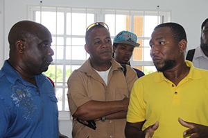 (L-R) Minister of Agriculture on Nevis Hon Alexis Jeffers, Permanent Secretary in the Ministry of Agriculture Eric Evelyn, Manager of the Nevis Agro Processing Centre Dwight Brown touring the Centre at Prospect on November 04, 2014