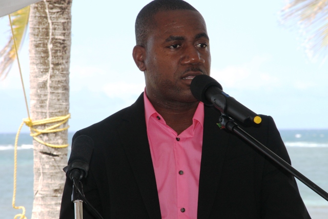 Deputy Prime Minister of St. Kitts and Nevis Hon. Shawn Richards delivering remarks at the ground breaking ceremony of the HTRIP Candy Resort Villa Development at Liburd Hill on Nevis on April 17, 2015
