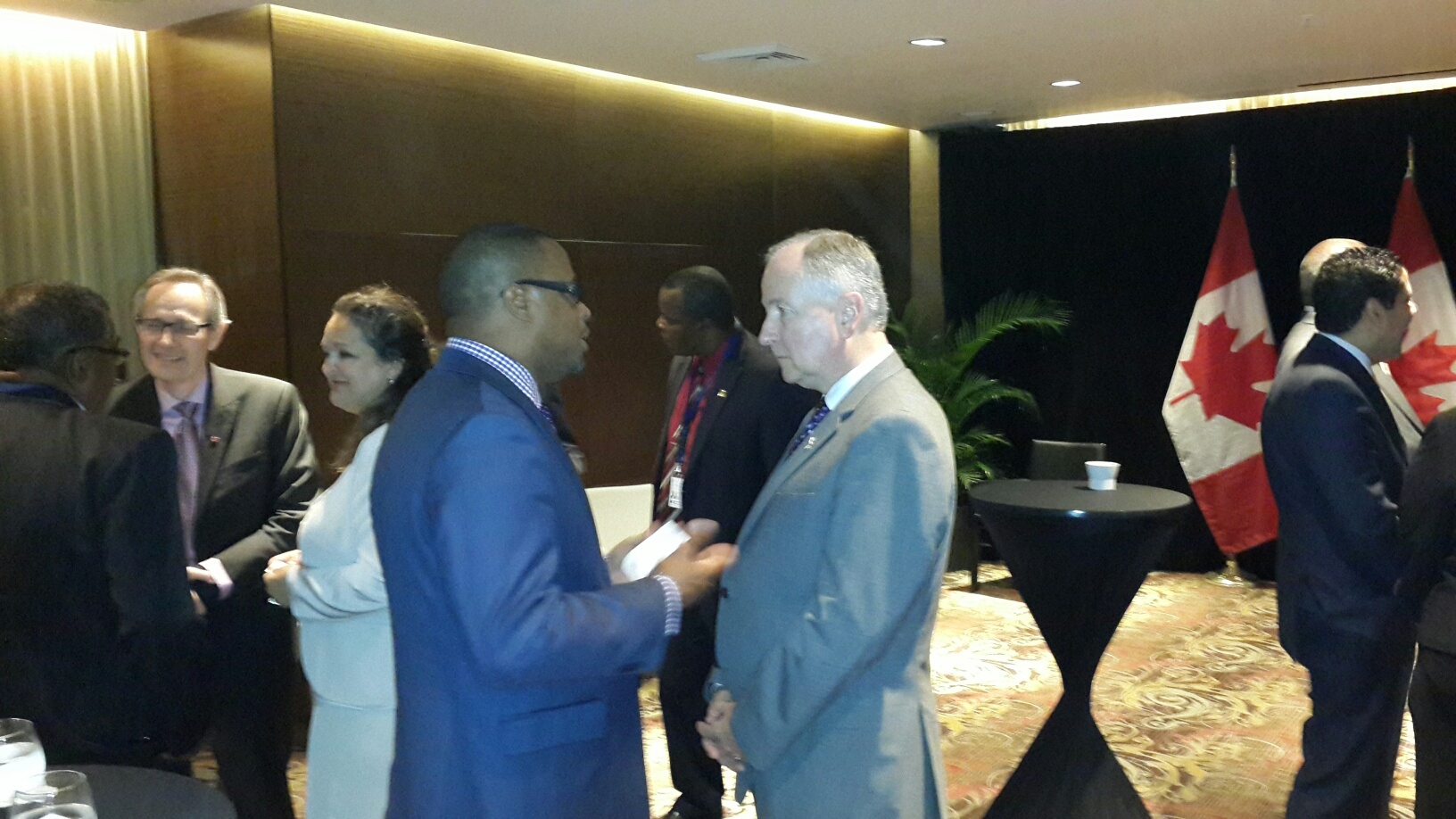 St. Kitts and Nevis Foreign Affairs Minister and Deputy Premier of Nevis Hon. Mark Brantley (center left) with Canadian Foreign Affairs Minister Rob Nicholson (center right) on April 10, 2015, at a cocktail hosted by the Canadian Official for Caribbean Community Foreign Affairs Ministers attending the Summit of the Americas in Panama