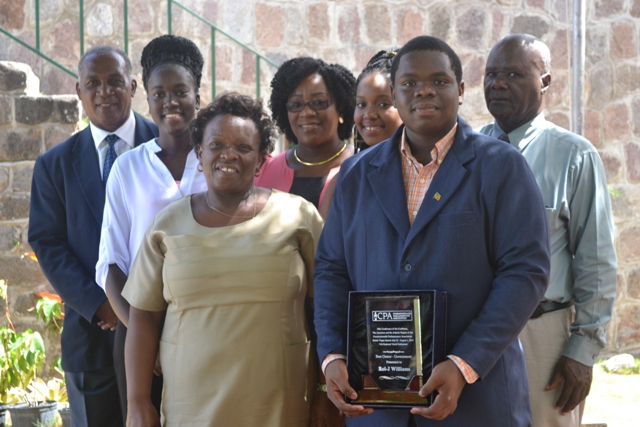 Back row (L-R) Premier of Nevis Hon. Vance Amory, Youth Parliamentarian Joanne Manners, Clerk of the Nevis Island Assembly Shemica Maloney, Youth Parliamentarian Shanai Liburd and President of the Nevis Island Assembly Hon. Farrell Smithen. (Front row) Youth Parliamentarian Rol-J Williams with his Commonwealth Parliamentary Association Award and his mother Janice Williams