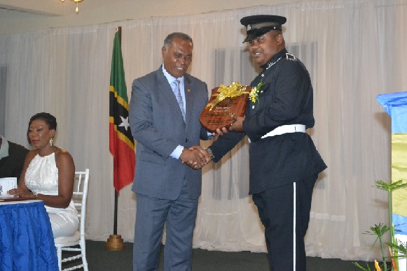 Constable Antonio Brown receiving plaque for most outstanding Constable of the Year 2015 during Constables’ Awards Ceremony held on February 06 2016 at Occasions Entertainment Arcade