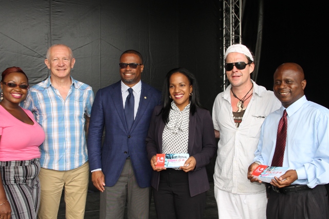 (L-R) Chairman of the local committee for the Nevis Blues Festival Shari Greaves, producer of the festival Richard Pavitt, Deputy Premier of Nevis and Minister of Tourism and Health Hon. Mark Brantley, Permanent Secretary in the Ministry of Health Nicole Slack-Liburd, renown Blues singer Ian Seigal, and Permanent Secretary in the Premier’s Ministry with responsibility for Education Wakely Daniel at Oualie Bay on April 12, 2016, after a handing over ceremony of Nevis Blues Festival organisers’ gift of tickets to nurses and teachers to attend the opening night of the 2nd edition of Nevis Blues Festival