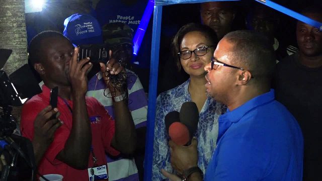 Premier of Nevis Elect Mr. Mark Brantley delivering his victory speech outside the party headquarters on Government Road in Charlestown on December 19, 2017, following his party’s victory at the Nevis Island Assembly elections on December 19, 2017. His wife Sharon looks on