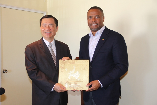 (l-r) His Excellency Mr. George Gow-Wei Chiou Resident, Ambassador to St. Kitts and Nevis for the Republic of China (Taiwan) presents the manual for the newly-installed Health Information System at the Alexandra Hospital on December 08, 2017