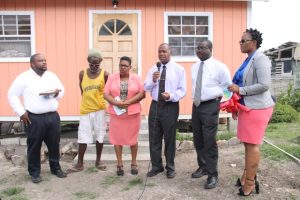 (l-r) Pastor Ron Daniel, Mr. Joseph Belgrave, Ms. Joyce Moven, Deputy Director at the Department of Social Services, Hon. Eric Evelyn, Minister of Social Development on Nevis, Mr. Keith Glasgow, Permanent Secretary in the Ministry of Social Development and Mrs. Shelly Liburd who oversees community housing assistance projects at the handing over ceremony of a new home to Mr. Belgrave at Spring Hill on June 14, 2018