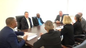 Another view of Hon. Mark Brantley, Premier of Nevis and Mrs. Hélène Ann Lewis, Legal Adviser to the NIA (to his immediate right) meeting with representatives of the Overseas Private Investment Corporation (OPIC) based in Washington (left), and geothermal developers of Nevis Renewable Energy International (right) at his office at Pinney’s Estate on July 30, 2018
