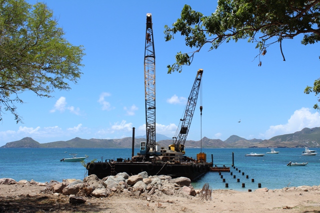 Work on the new state-of-the-art water taxi pier at Oualie Bay on August 23, 2018, with the barge and 200ft of piles planted offshore for the 300ft facility