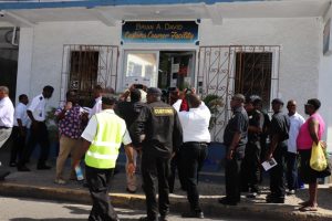 Curious onlookers and invited guests outside the Customs Courier Facility in Charlestown following the renaming ceremony and unveiling on October 25, 2018