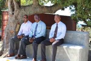 (l-r) Mr. Raoul Pemberton, Director of the Public Works Department; Dr. Ernie Stapleton, Permanent Secretary in the Ministry of Public Works; and Hon. Spencer Brand, Acting Premier of Nevis and Minister of Public Works experience the sitting area constructed over a main culvert in Brown Hill as part of the Brown Hill Road Rehabilitation project while touring the project on October 31, 2018