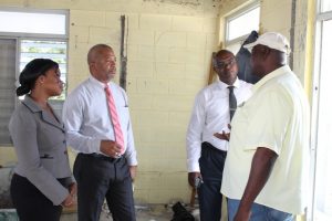 (Second from left) Hon. Spencer Brand, Minister of Communications and Works on Nevis' speaks with contractor (extreme right) Mr. Alton Brown at the Charlestown Primary School ongoing expansion project. Looking on are (extreme right) Ms. Latoya   Jeffers, Charlestown Primary School Principal, and (second from right) Dr. Ernie Stapleton, Permanent Secretary in the Ministry of Communication and Works