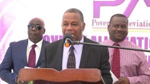Hon. Eric Evelyn, Minister of Social Development in the Nevis Island Administration flanked by (left) Hon. Alexis Jeffers, Deputy Premier of Nevis and (right) Mr. Keith Glasgow, Permanent Secretary in the Ministry of Social Development at the launch of the Poverty Alleviation Programme on Nevis on December 24, 2018 in Charlestown