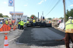 Employees from the Public Works Department asphalting the main entrance to Bath Village from Charlestown on February 13, 2019
