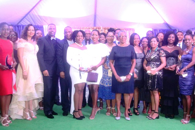 Photo caption: Some of the 32 university graduates with Hon Mark Brantley, Premier of Nevis, and Her Honour Hyleeta Liburd, Deputy Governor-General of Nevis (first row second from right), First Lady Mrs. Sharon Brantley; Hon. Eric Evelyn (second, third and fourth from right respectively in the second row) at the First Congratulatory Reception for University Graduates hosted by Premier Brantley and First Lady Mrs. Sharon Brantley at Government House at Belle Vue on February 09, 2019