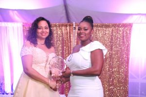 First Lady Mrs. Sharon Brantley presents plaque to graduate Ms. Lisa Lee at the First Congratulatory Reception for University Graduates hosted by Hon. Mark Brantley, Premier of Nevis and Mrs. Brantley at Government House at Belle Vue on February 09, 2019  