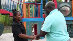 Mr. Mac Kee France, Director of Guest Experiences at the Four Seasons Resort, Nevis, presenting a playground to Mrs. Naomi Douglas, Supervisor/Proprietor of Naomi’s Nursery and Pre School, in Garrick’s Pasture, Jessups Village recently