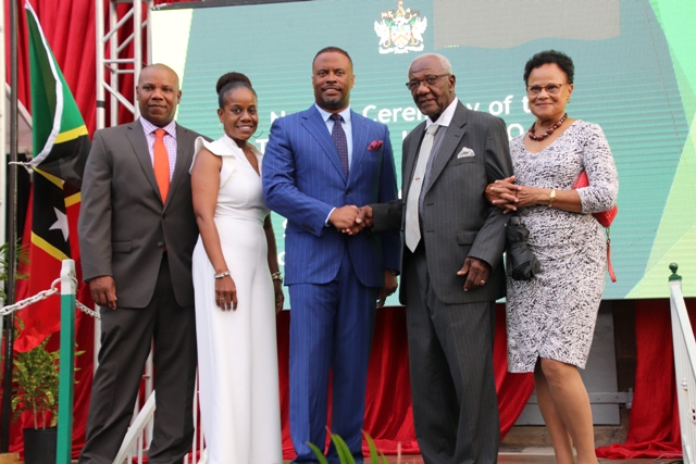 Mr. Theodore Hobson Q.C. and his family with Hon. Mark Brantley, Premier of Nevis standing in front of the newly named Theodore L. Hobson Court Building in Charlestown on April 28, 2019