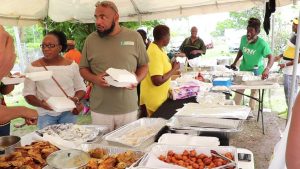 Mr. Huey Sargeant, Permanent Secretary in the Ministry of Agriculture, among patrons at the Jessups Seafood Fiesta 2019 at Jessups Village on May 06, 2019, an activity on the Ministry of Tourism’s Exposition Nevis 2019 calendar