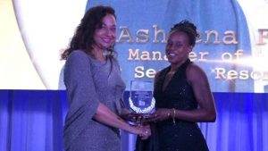 Ms. Asheena Farrell of the Four Seasons Resort, Nevis receives the award for Hotel Manager of the Year 2019 from First Lady Mrs. Sharon Brantley at the Ministry of Tourism’ s Nevis Tourism Industry Awards ceremony on May 25, 2019, on the grounds of Government House at Bath Plain