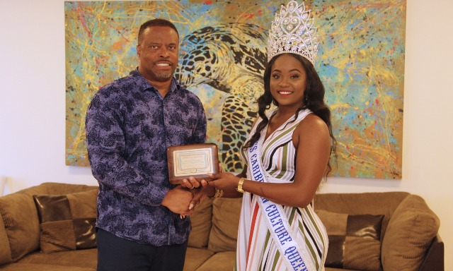 Hon. Mark Brantley, Premier of Nevis receives a token of appreciation from Ms. Shellisa Nanton of St. Vincent and the Grenadines, the reigning Flow Miss Caribbean Culture Queen at his Pinney’s office on August 02, 2019