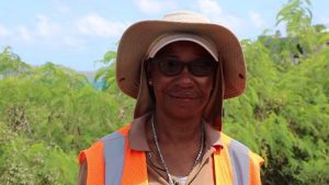 Ms. Loretta Greene Phillip a flag lady with Surrey Paving &Aggregate Co. Ltd, contractors for Phase 1 of the Nevis Island Administration’s EC$6.7 million Island Main Road Rehabilitation and Safety Improvement Project from Cotton Ground to Cliff Dwellers at work on the project on August 13, 2019