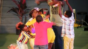  Ms. Idella Wallace, the new Miss Nevis Senior Queen mobbed by some younger members of her family at the Miss Nevis Senior Pageant hosted by the Ministry of Social Development through the Department of Social Services, Senior Citizens Division at the Cultural Village on October 26, 2019, moments after she was announced as the winner