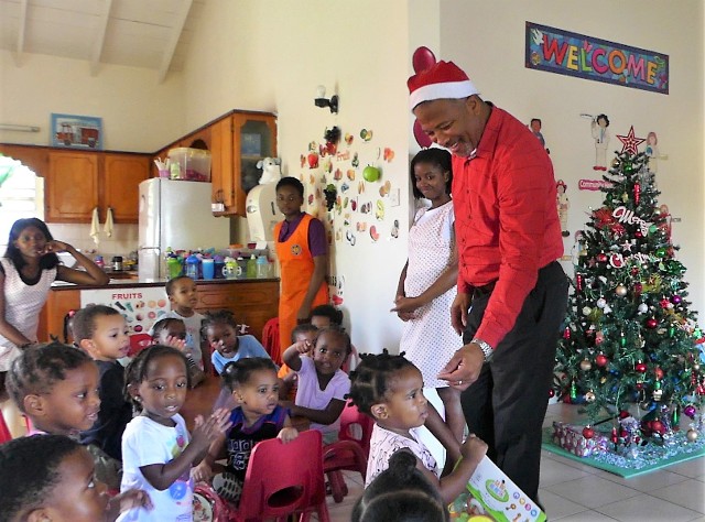 Hon. Spencer Brand, Area Representative for the St. Paul’s Parish with Ms. Oneka Fortune, Supervisor of the Steppin’ Stone Nursery Phase 1 at Stoney Grove in Charlestown during a recent visit spreading Christmas cheer