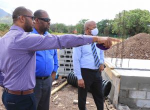 Hon. Spencer Brand, Minister of Communications and Works in the Nevis Island Administration (right), visiting the construction site of a cold storage facility at the government-owned farm at Prospect on June 17, 2020, accompanied by Mr. Alister Thompson Building Supervisor (middle) and Mr. Raoul Pemberton, Director of the Public Works Department on Nevis