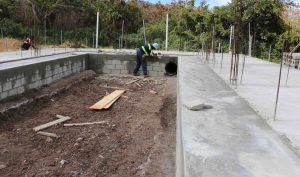 Workmen from the Public Works Department constructing a cold storage facility at the Department of Agriculture’s Prospect farm on June 17, 2020 
