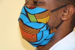 A model shows the side view of a locally made fabric mask