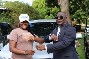 Hon. Alexis Jeffers, Deputy Premier and Minister of Agriculture, hands over the keys to a vehicle to Ms. Shaquinha Hanley, Senior Agricultural Officer in the Department of Agriculture on July 21, 2020, at the Prospect Agricultural Station