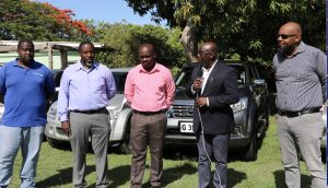 Mr. Kelso Clark, Senior Agricultural Officer in charge of the Livestock Extension Unit in the Department of Agriculture; Mr. Floyd Liburd, Assistant Director in the Department of Agriculture; Mr. Randy Elliott, Director of the Department of Agriculture; Hon. Alexis Jeffers, Deputy Premier of Nevis and Minister of Agriculture; and Mr. Huey Sargeant, Permanent Secretary in the Ministry of Agriculture at the handing over ceremony of four vehicles to the Ministry and Department of Agriculture on July 21, 2020 at the Prospect Agricultural Station