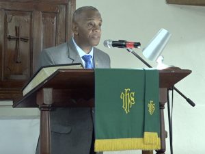 Hon. Eric Evelyn, Senior Minister in the Nevis Island Administration, and Federal Minister of Environment and Cooperatives, reading a scripture at a “United in Christ, Giving Thanks and Praise” church service at the Gingerland Methodist Church on July 19, 2020