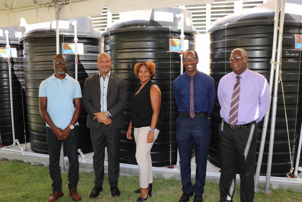 (l-r) Denison Paul of WaterWorks Solutions; Hon. Spencer Brand, Minister of Environment and Water Services in the Nevis Island Administration; Ms. Sharon Rattan, Permanent Secretary in the Ministry of Environment (St. Kitts); Kevin Barrett, Permanent Secretary in the Ministry of Education in the Nevis Island Administration; Juan Williams, Principal of Charlestown Secondary School at a ceremony to commission a water storage system at the Charlestown Secondary School on October 20, 2020