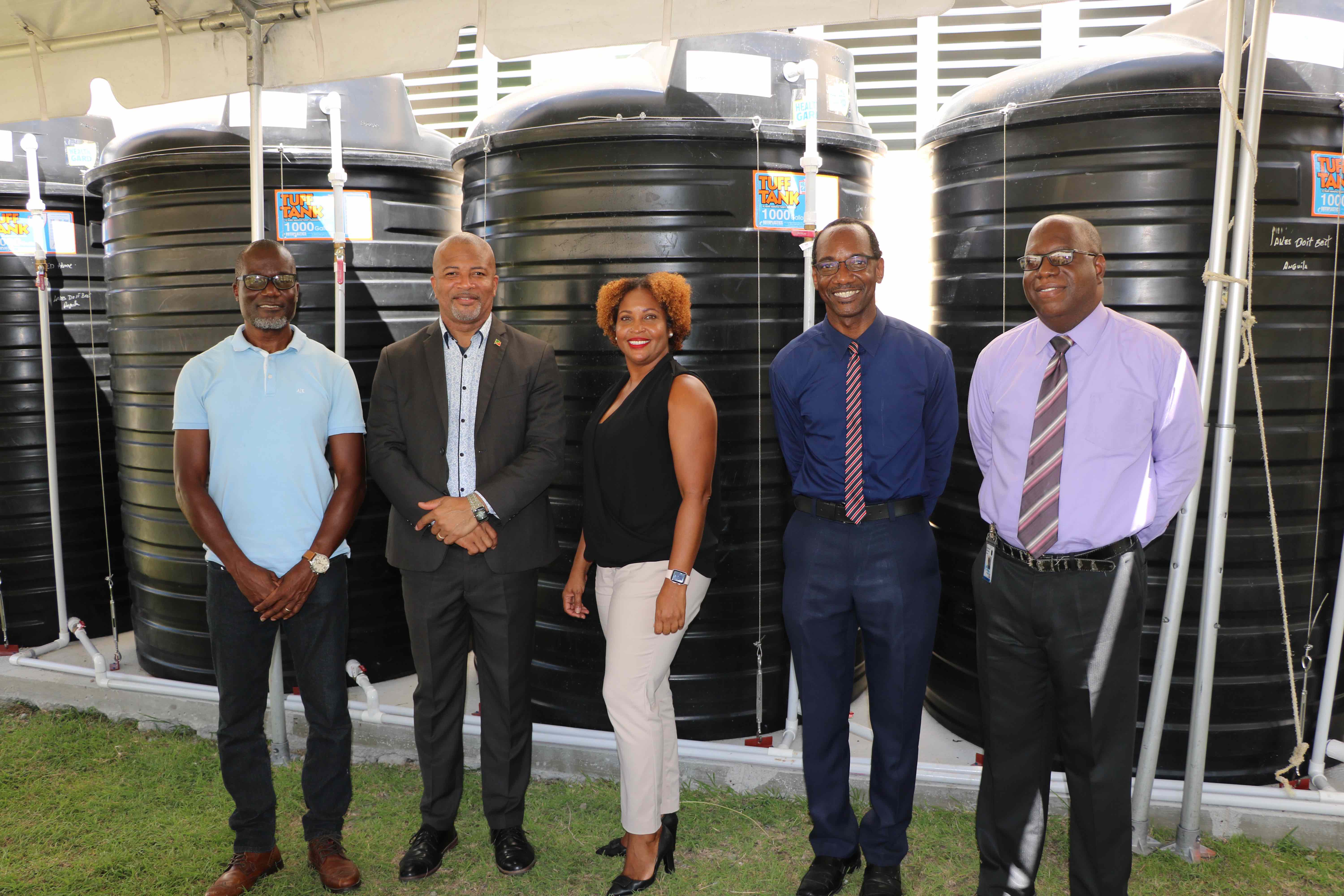 (l-r) Denison Paul of WaterWorks Solutions; Hon. Spencer Brand, Minister of Environment and Water Services in the Nevis Island Administration; Ms. Sharon Rattan, Permanent Secretary in the Ministry of Environment (St. Kitts); Kevin Barrett, Permanent Secretary in the Ministry of Education in the Nevis Island Administration; Juan Williams, Principal of Charlestown Secondary School at a ceremony to commission a water storage system at the Charlestown Secondary School on October 20, 2020
