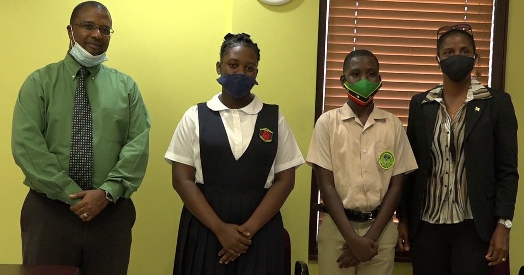 Mr. Adrian Daniel, Director of the Board at the Bank of Nevis and son of the late Sir Simeon with recipients Benjamin Clarke of the Gingerland Secondary School; Adeille Webbe of the Charlestown Secondary School; and Janice Daniel-Hodge, daughter of the late Sir Simeon during a ceremony to award the Bank of Nevis Limited’s Right Excellent Dr. Sir Simeon Daniel Scholarships for 2020 in Charlestown on December 04, 2020