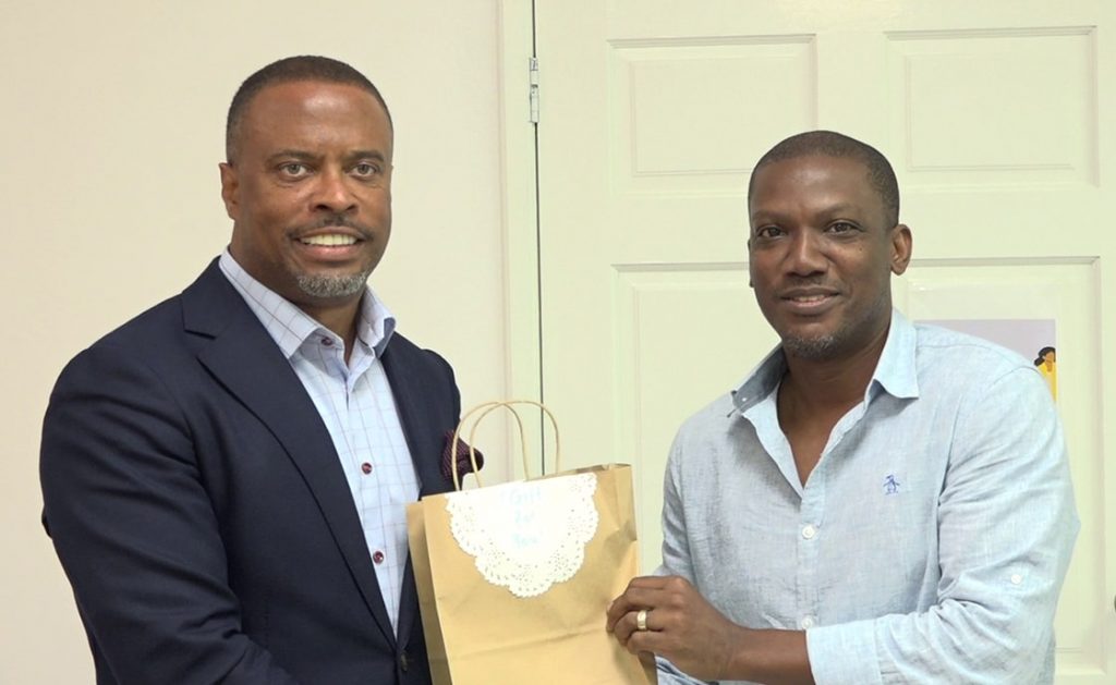 (L-r) Hon. Mark Brantley, Premier of Nevis, Minister of Information Technology and Minister of Gender Affairs in the Nevis Island Administration with Mr. Rodney Browne, Chief Executive Officer of eCaribbean Ltd, and facilitator of the Division of Gender Affairs’ web development boot camp launched on January 09, 2021, at the Gender Affairs Division conference room in Charlestown