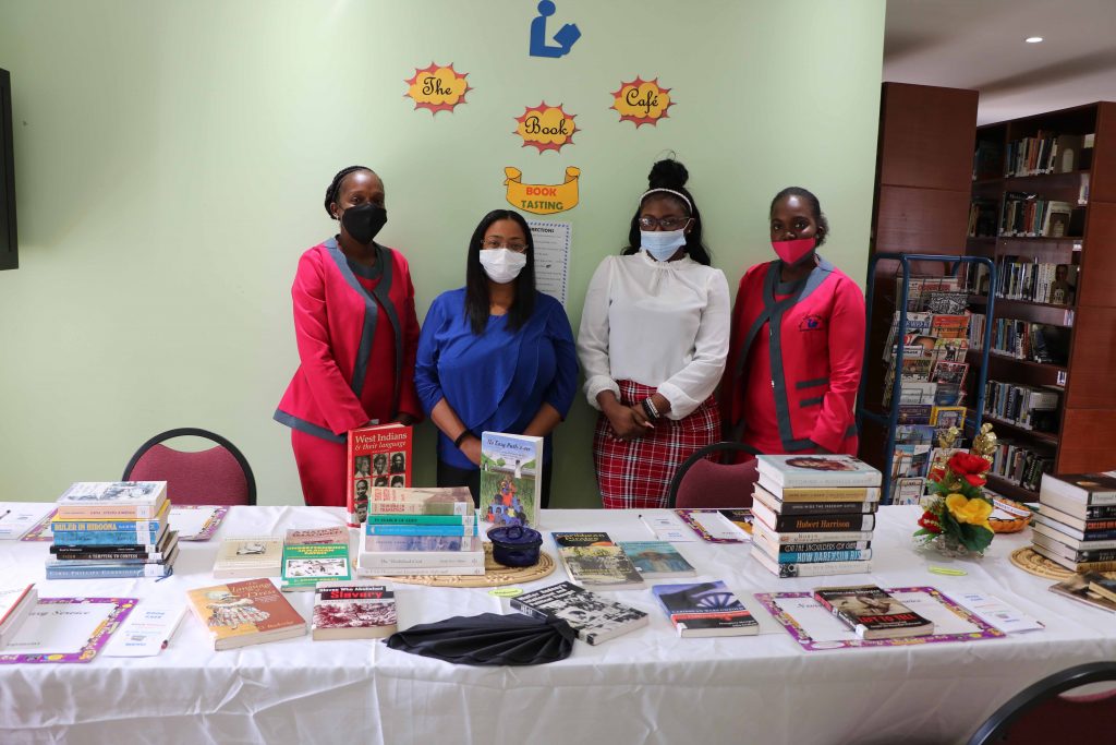 Mrs. Anastasia Parris-Morton, Chief Librarian at the Nevis Public Library with staff members Ms. Tisha Brookes, Ms. Natalya Roberts and Ms. Janell Prentis with some of the books available for selection for a “Book Tasting” from February 15 to 20, 2021 for Black History Month at the Nevis Public Library on Market Street in Charlestown