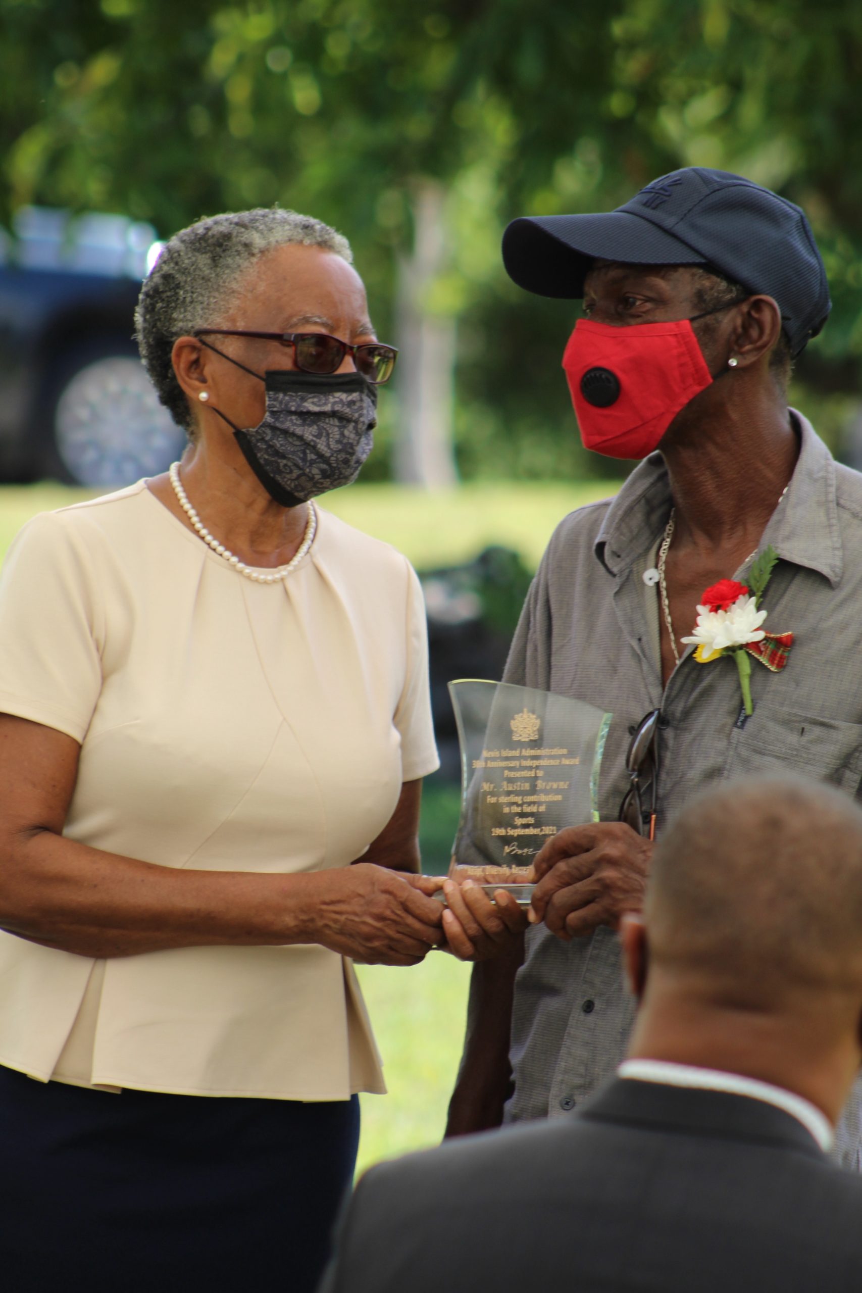 Her Honour Mrs. Hyleeta Liburd, Deputy Governor general on Nevis presenting a plaque to Mr. Austin Browne at an Awards ceremony at Government House on September 20, 2021, at Government House on the occasion of the 38th Anniversary of Independence of St. Christopher and Nevis