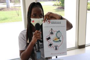 Ms. Dijonne Hanley one of 11 students hired by Taiwan’s Trade Development Council to introduce products on behalf of Taiwanese business people at the Taiwan Expo in St. Kitts and Nevis, introducing commercial Restaurant Kitchen Appliances at the Malcolm Guishard Recreational Park at Pinney’s on December 20, 2021