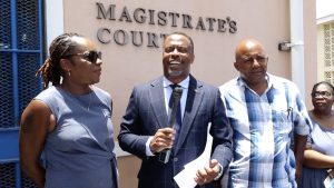 Hon. Mark Brantley of the Concerned Citizens Movement candidate for Nevis 9 to contest the August 05 National Assembly Elections flanked by his witnesses Lorna Hunkins of Marion Heights (left) and Dennis Browne of Brown Hill (right) moments after his nomination at the Charlestown Magistrate’s Court on July 26, 2022