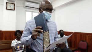 Samuel Caines, of the Moral Restoration Movement taking his oath during his nomination as a candidate for Nevis 9 to contest the August 05 National Assembly Elections at the Charlestown Magistrate’s Court on July 26, 2022, while his witnesses Cheryl Edwards of Craddock Road (seated left) and Carlos E. Williams of Upper Government Road (seated right) look on