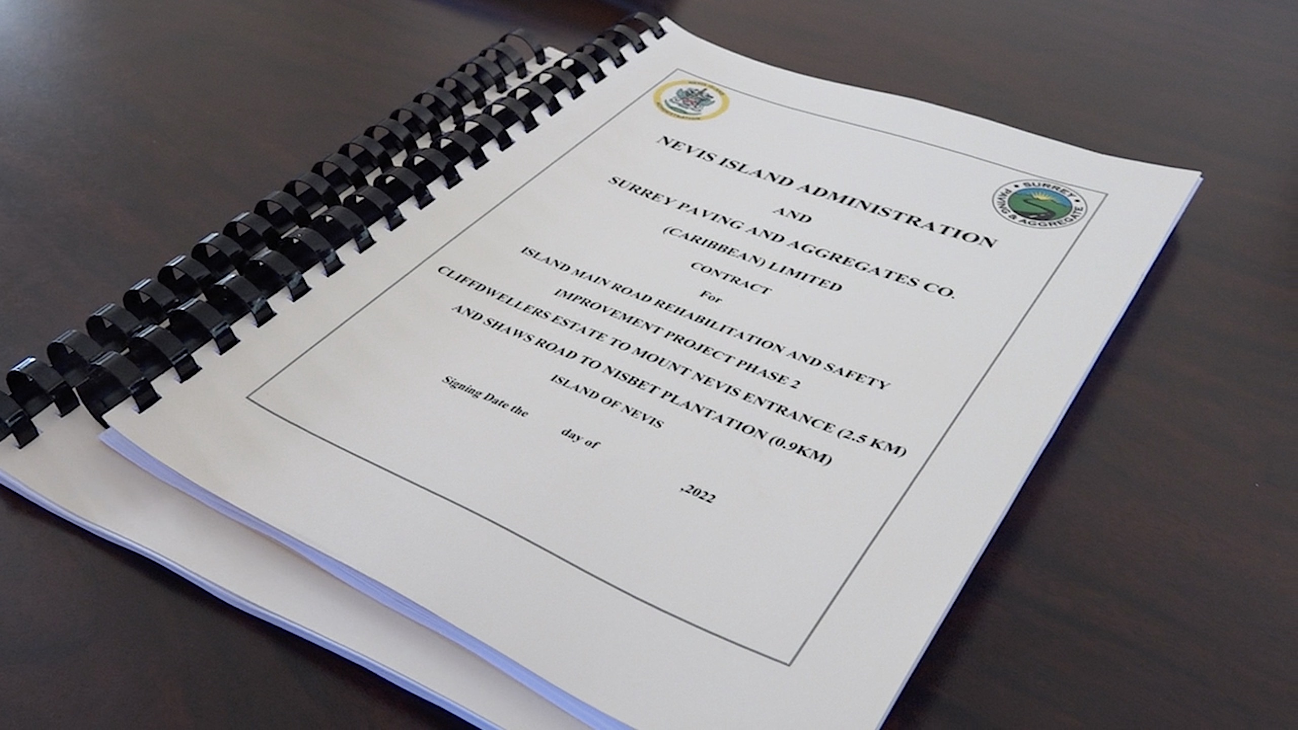 The contract for Island Main Road Rehabilitation and Safety Improvement Project Phase 2 signed on behalf of the Nevis Island Administration by Dr. Ernie Stapleton, Permanent Secretary in the Ministry of Communications and Works; and Mr. Michael Morrison, Project Manager, and Ms. Xia-Xiang Claxton, Quality Engineer, on behalf of Surrey Paving & Aggregate Company Caribbean Ltd.