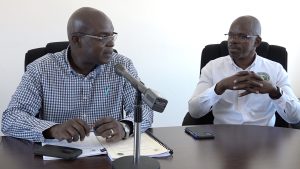 (l-r) Dr. Ernie Stapleton, Permanent Secretary in the Ministry of Communications and Works and Mr. Michael Morrison, Project Manager for Surrey Paving & Aggregate Company Caribbean Ltd. at the contract signing ceremony on October 14, 2022 at the Nevis Island Administration’s Conference Room in Charlestown