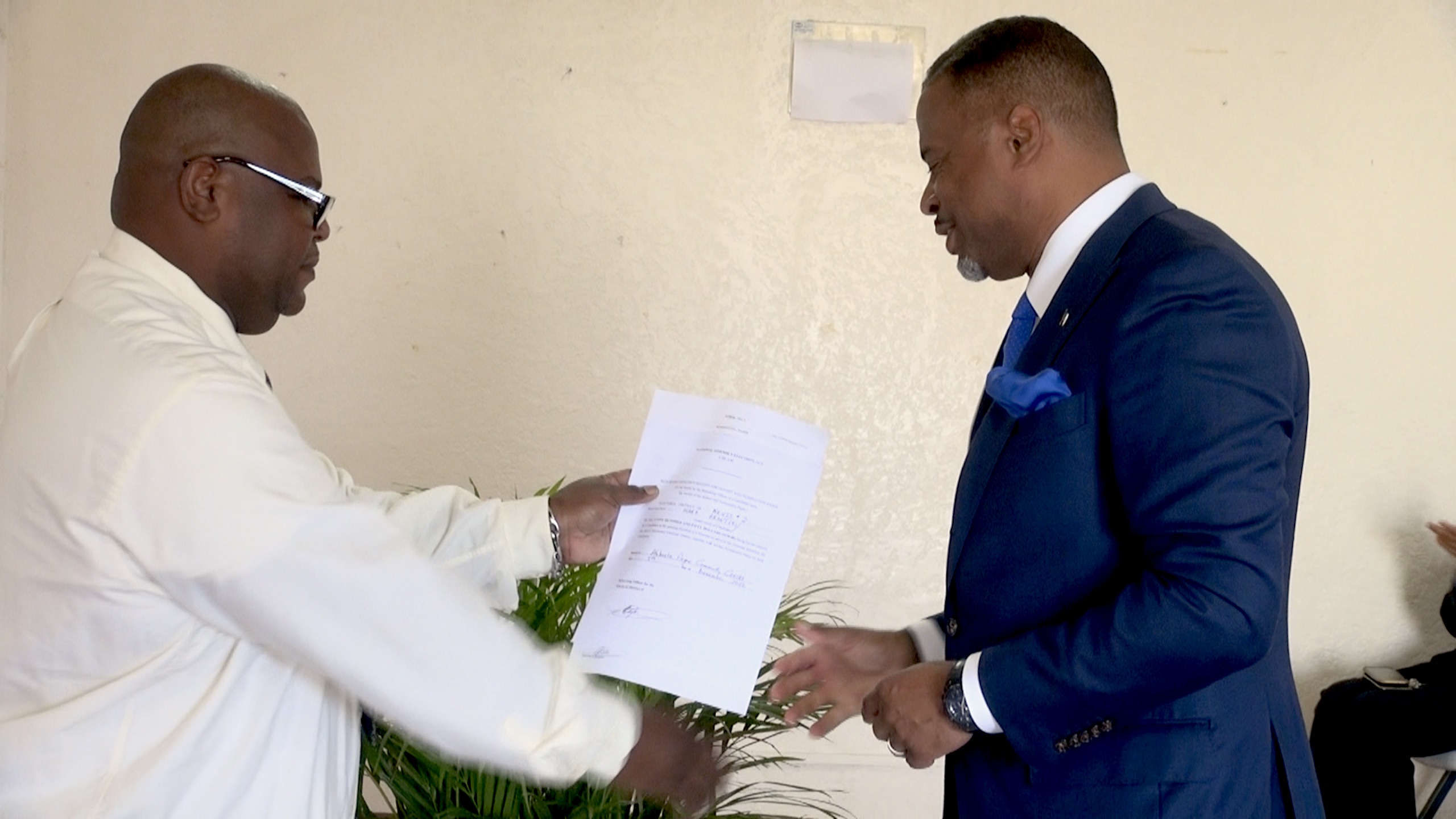 Hon. Mark Brantley, Leader of the Concerned Citizens Movement (CCM) with Mr. Rohan Claxton, Returning Officer for the Constituency of Nevis 2 on December 05, 2022