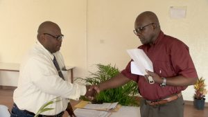 Mr. Samuel Caines, Leader of the Moral Restoration Movement (MRM) with Mr. Rohan Claxton, Retuning Officer for the Constituency of Nevis 2 on December 05, 2022