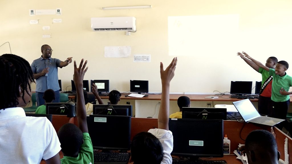 His Excellency Larry Vaughan, Head of the Regional Integration and Diaspora Unit in the Office of the Prime Minister of St. Kitts and Nevis interacting with students at the St. Thomas’ Primary School on June 14, 2023, as part of the activities marking the organisation’s 42nd anniversary in St. Kitts and Nevis